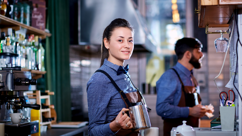 Barista working at a coffee machine